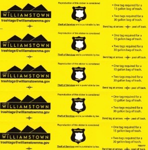 An image showing what the black and yellow trash bag tags look like.